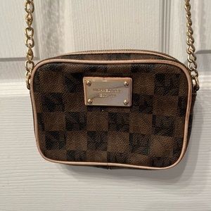 Petite yet statement-making Michael Kors crossbody bag
